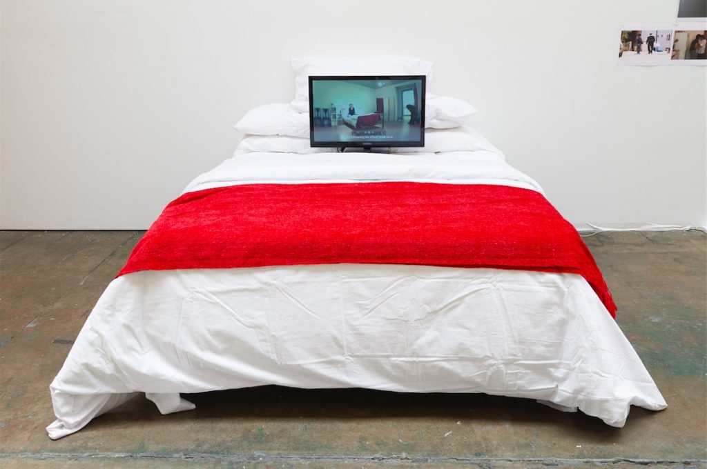 Liz Crow, Bedding Out, 2013, Video. 8:57, installation with bed