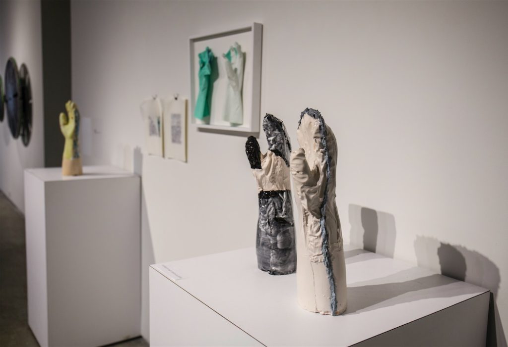 Funda Susamoglu, Handmade, 2013, Mixed media installation (ceramics, rubber gloves, paper), each ceramic piece is 16 x 6 x 4.7”